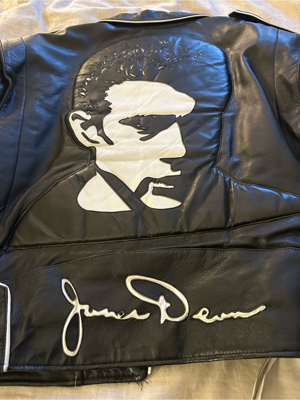 Black Leather Bomber Jacket with White Portrait Appliqué by John Dean